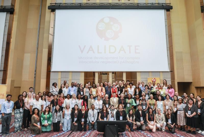 The VALIDATE Annual Meeting 2024 - A group photo of all delegates below the VALIDATE Logo
